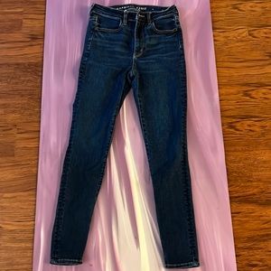 Dark blue wash, stretchy high rise American Eagle skinny jeans size 6.